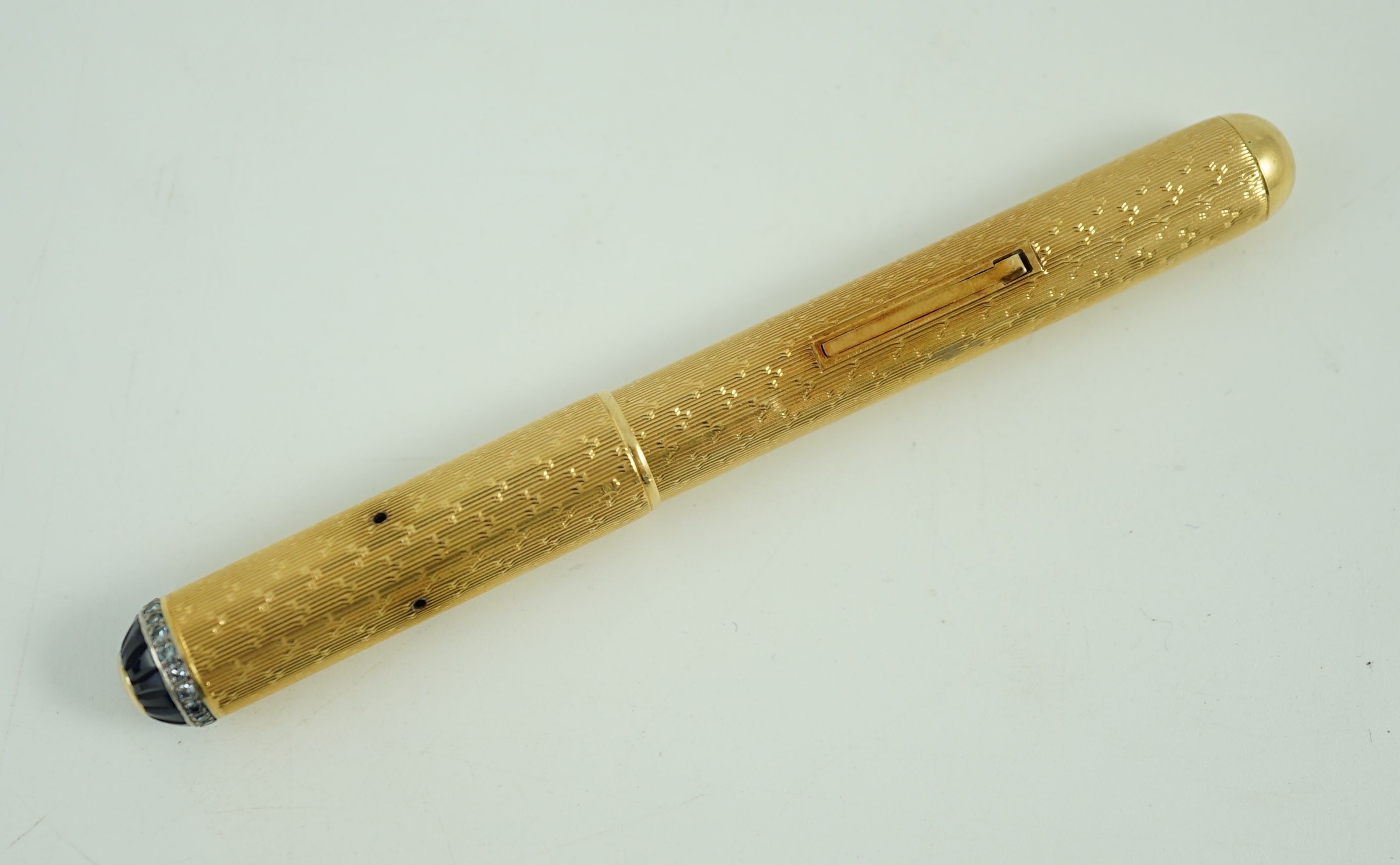 A late 1930's 18ct gold cased and sapphire and diamond set side lever fountain pen, 11cm